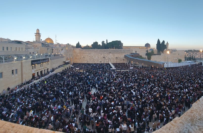  A mass prayer event for the welfare of the hostages in Gaza takes place at the Western Wall last week. (photo credit: MARC ISRAEL SELLEM/THE JERUSALEM POST)