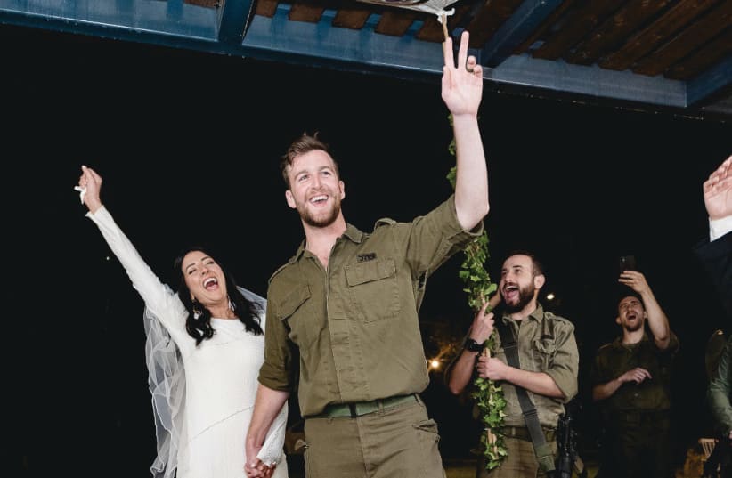  JAKE AND MORGAN decided to do one of the most meaningful things to show that life and love continue in Israel after such a tragedy, and got married while Jake was still on reserve duty. (photo credit: RAN BERGMAN)