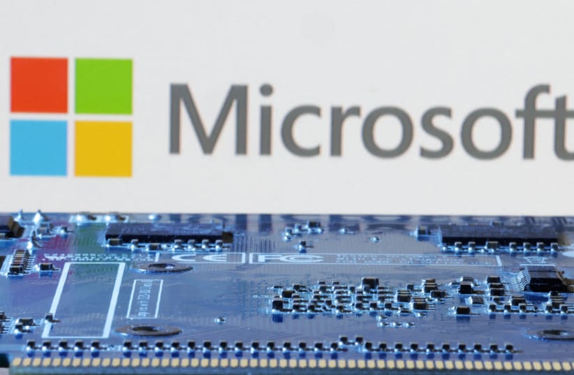  Microsoft logo is seen near computer motherboard in this illustration taken January 8, 2024. (photo credit: REUTERS/DADO RUVIC/ILLUSTRATION/FILE PHOTO)