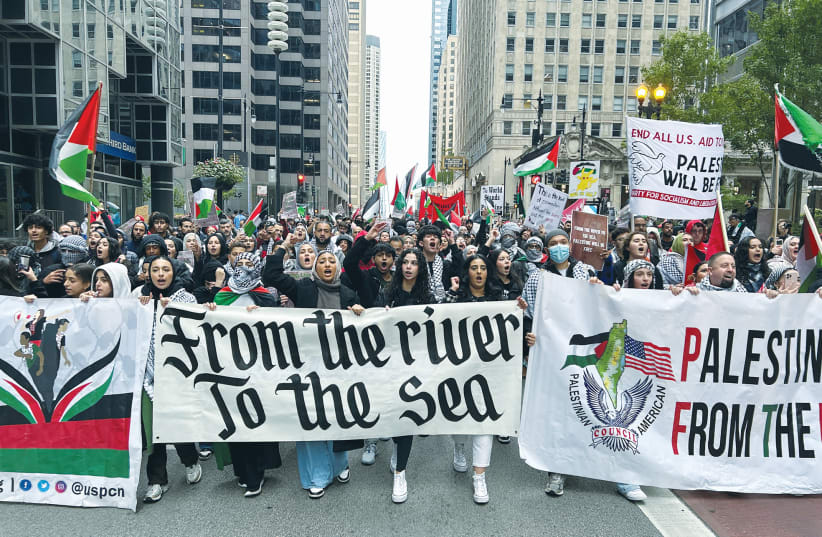  PALESTINIAN AMERICANS and their supporters march in downtown Chicago, on October 8, the day after the Hamas massacres in Israel. ‘Following October 7, I have felt isolated, frustrated, angry, and afraid,’ says the writer. (photo credit: ERIC COX/REUTERS)