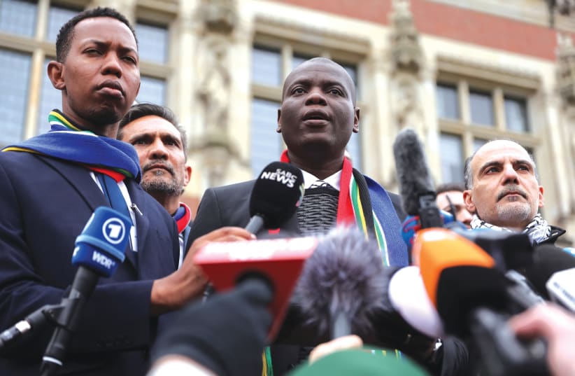  OUTH AFRICA’S Justice Minister Ronald Lamola speaks to the media as his country presents its case against Israel on January 11 at the International Court of Justice in The Hague.  (photo credit: THILO SCHMUELGEN/REUTERS)