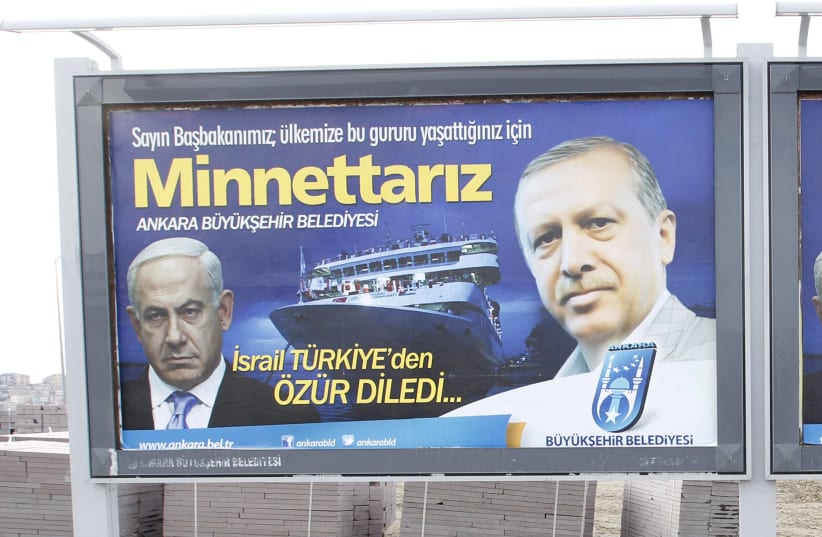  A billboard showing Turkey's President Erdogan (R) and Israeli Prime Minister Benjamin Netanyahu (L), in Ankara March 25, 2013 (photo credit: UMIT BEKTAS/REUTERS)
