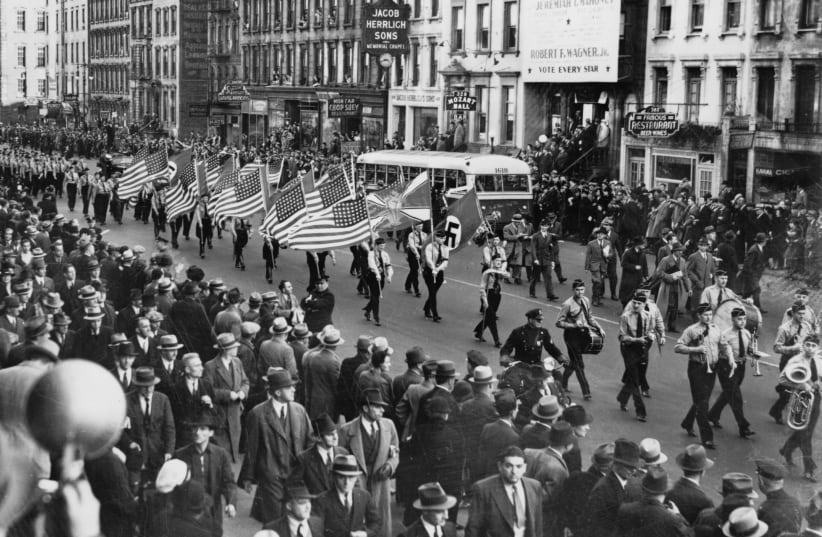 German American Bund parade in New York City on East 86th St. between First and Second Avenues, Oct. 30, 1937 / World-Telegram photo. (photo credit: PUBLIC DOMAIN)