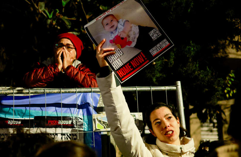  Families of hostages and supporters take part in a protest to call for the immediate release of hostages kidnapped during the deadly October 7 attack by Palestinian Islamist group Hamas, outside Israeli Prime Minister Benjamin Netanyahu's residence, in Jerusalem January 22, 2024.  (photo credit: REUTERS/AMMAR AWAD)