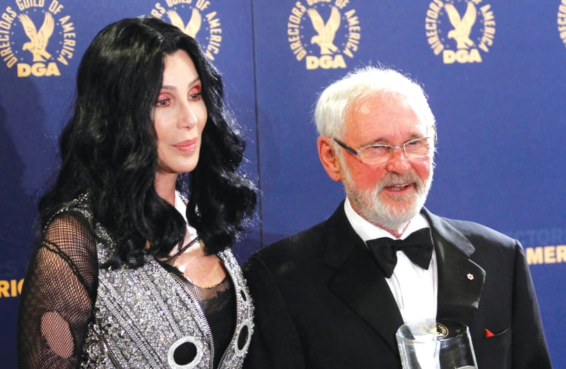  DIRECTOR Norman Jewison holds a Lifetime Achievement Award presented to him by Cher at the 62nd Annual Directors Guild of America Awards in Los Angeles in 2010. (photo credit: DANNY MOLOSHOK/REUTERS)