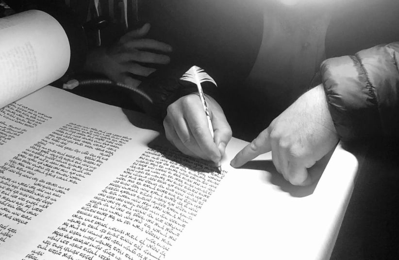  The completion of the Torah scroll (photo credit: Shimon Rosen)