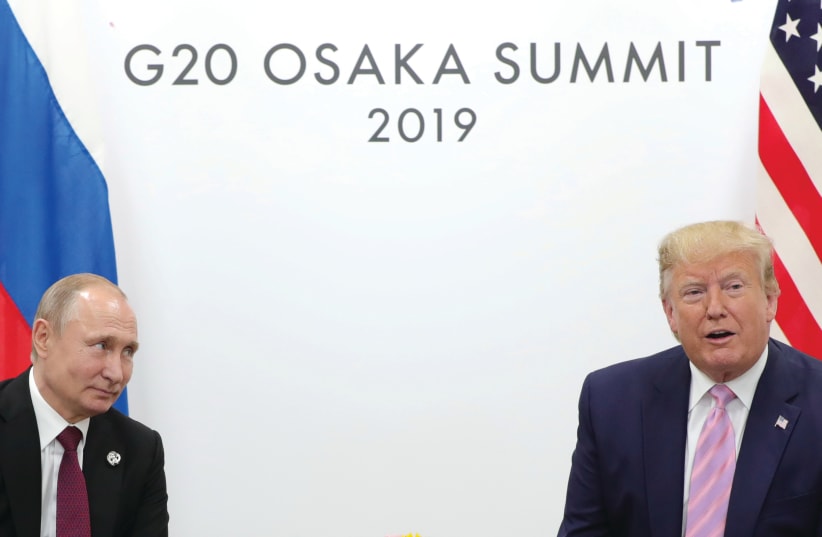 RUSSIA’S PRESIDENT Vladimir Putin and then-US president Donald Trump attend a meeting on the sidelines of the G20 summit in Osaka, Japan in 2019.  (photo credit: Sputnik/Kremlin via REUTERS)