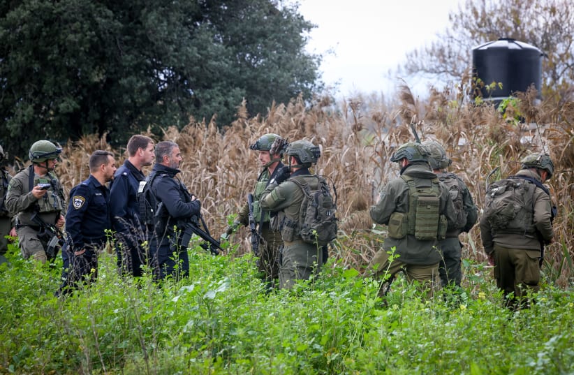  Israeli security forces at the site where two drones crashed in an open area near Kfar Blum, northern Israel, January 25, 2024 (photo credit: David Cohen/Flash90)