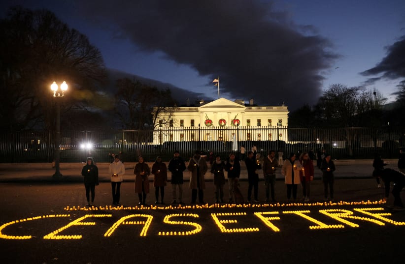  Staff and volunteers of Amnesty International USA, MoveOn, Oxfam America and Win Without War hold a vigil outside the White House calling for a ceasefire in the ongoing conflict between Israel and the Palestinian Islamist group Hamas, in Washington, U.S., December 18, 2023.  (photo credit:  REUTERS/Leah Millis )