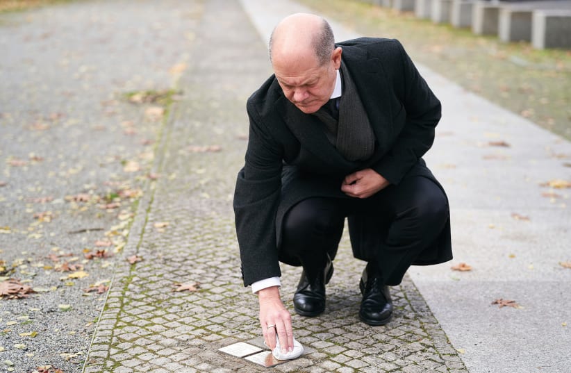  GERMAN CHANCELLOR Olaf Scholz cleans the 'stumbling blocks' for the couple Hans Goslar and Ruth Judith Goslar (née Klee) in Berlin in November. (photo credit: Henning Schacht/Pool/Getty Images)