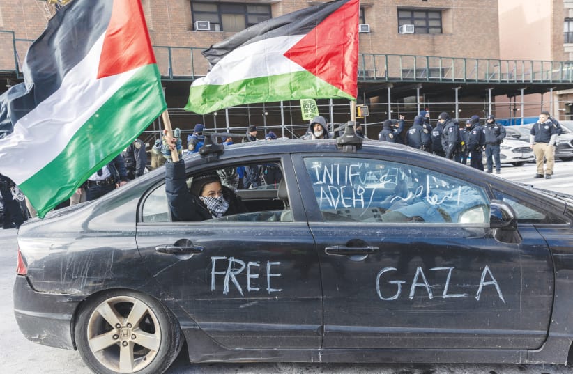  PRO-PALESTINIAN demonstrators protest in New York City, on January 20. (photo credit: JEENAH MOON/REUTERS)
