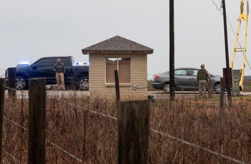  The gate at Holman Correctional Facility is monitored by law enforcement before the scheduled execution by asphyxiation using pure nitrogen of Kenneth Smith who is convicted for a murder-for-hire committed in 1988, in Atmore, Alabama, U.S. January 25, 2024. (photo credit: REUTERS/MICAH GREEN)