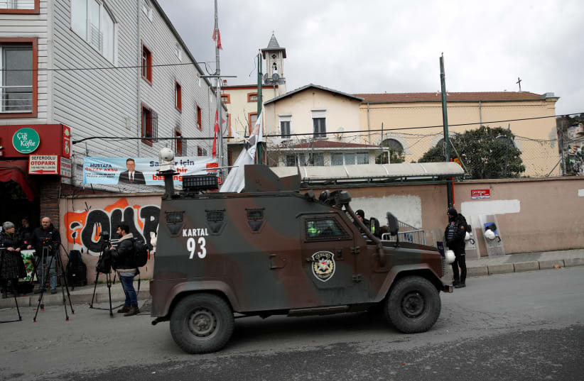  A Turkish police armoured vehicle drives outside the Italian Santa Maria Catholic Church after two masked gunmen were shooting during Sunday service, in Istanbul, Turkey January 28, 2024.  (photo credit: DILARA SENKAYA/REUTERS)