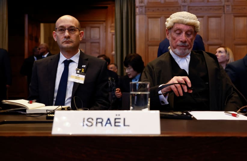  Israel's deputy Attorney-General for International Law Gilad Noam and British jurist Malcolm Shaw sit in International Court of Justice, The Hague, January 26, 2024 (photo credit: PIROSCHKA VAN DE WOUW/REUTERS)