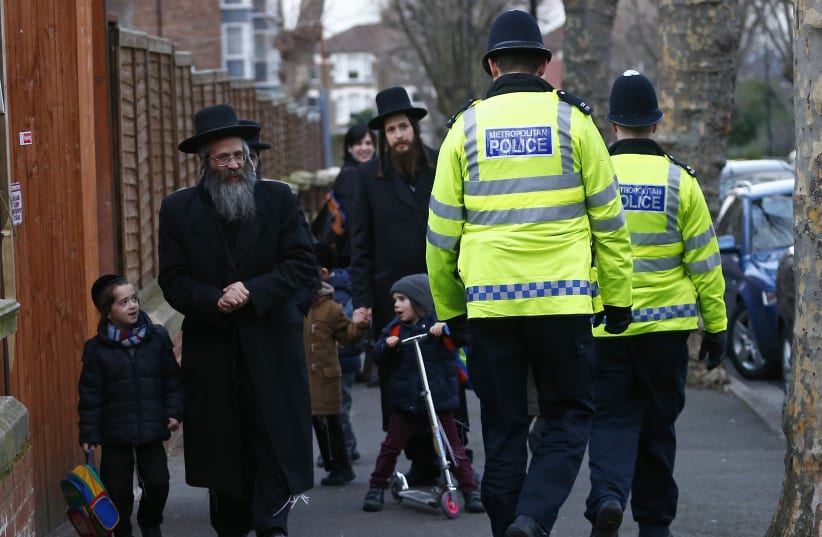  Members of the Jewish community collect their children from school in north London January 20, 2015 (photo credit: REUTERS/ANDREW WINNING)