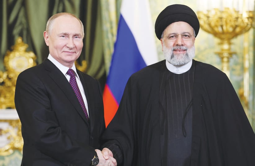 The Russian and Iranian Presidents meet in Moscow last month. Increasingly, Tehran is acting not just as an ally but as a proxy for Russia in the Middle East, much as it has its own regional proxies, the writers maintain. (photo credit: SPUTNIK/REUTERS)