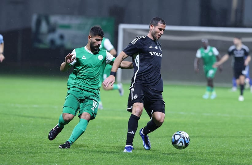  TOMER HEMED (in black) and Maccabi Haifa come on strong late in their State Cup round-of-32 clash with Hapoel Kfar Saba, claiming three goals in the extra session for a 6-3 victory.  (photo credit: Maccabi Haifa/Courtesy)