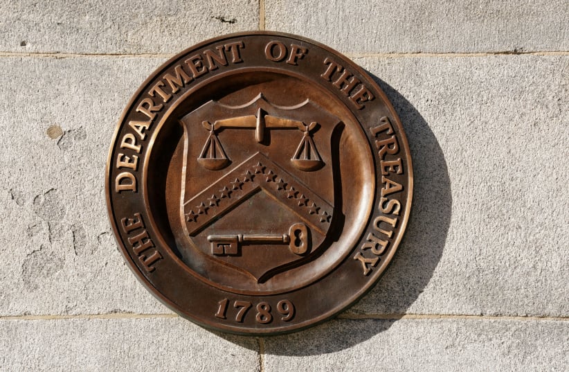   A bronze seal for the Department of the Treasury is shown at the U.S. Treasury building in Washington, US, January 20, 2023.  (photo credit: REUTERS/KEVIN LAMARQUE/FILE PHOTO)