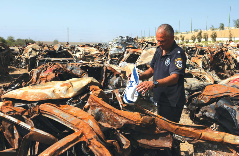  A SEARCH is held for human remains and other evidence among many destroyed vehicles in a field near Netivot, after the October 7 massacre by Hamas. Those calling for an end to the fighting have clearly forgotten that there was a ceasefire in place until the morning of October 7, the writer argues. (photo credit: RONEN ZVULUN/REUTERS)