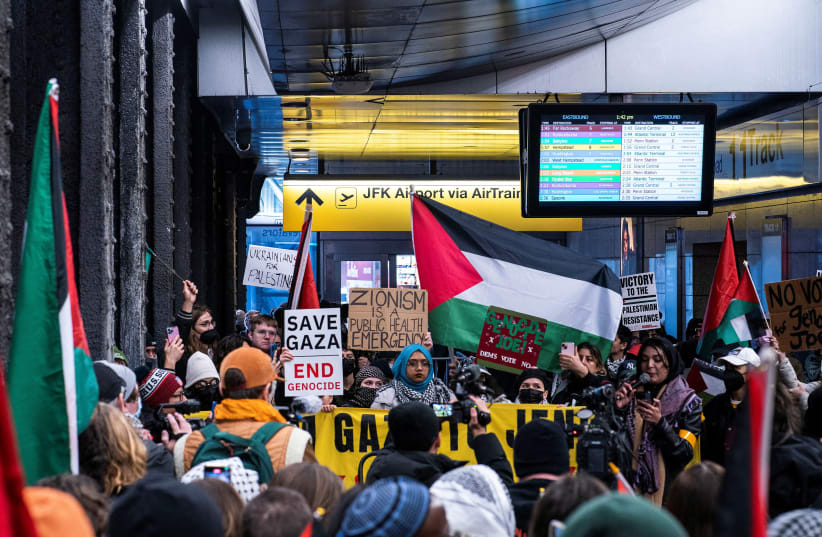  Pro-Palestinian demonstrators protest near the entrance of the Jamaica to JFK AirTrain Station in New York City, U.S., January 27, 2024. (photo credit: REUTERS/EDUARDO MUNOZ)
