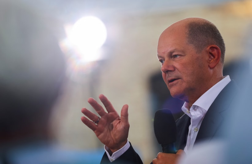  German Chancellor Olaf Scholz talks with citizens during an event in Magdeburg, Germany, August 25, 2022. (photo credit: REUTERS/FABRIZIO BENSCH)
