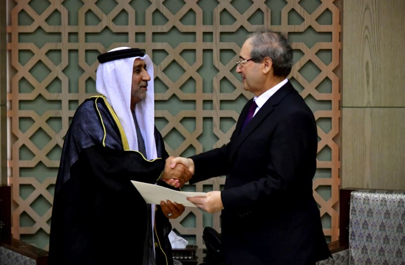  Syrian Foreign Minister Faisal Mekdad receives the credentials of the new ambassador of the United Arab Emirates to Syria, Hassan al-Shehi, in Damascus, Syria January 30, 2024. (photo credit: SANA/HANDOUT VIA REUTERS)