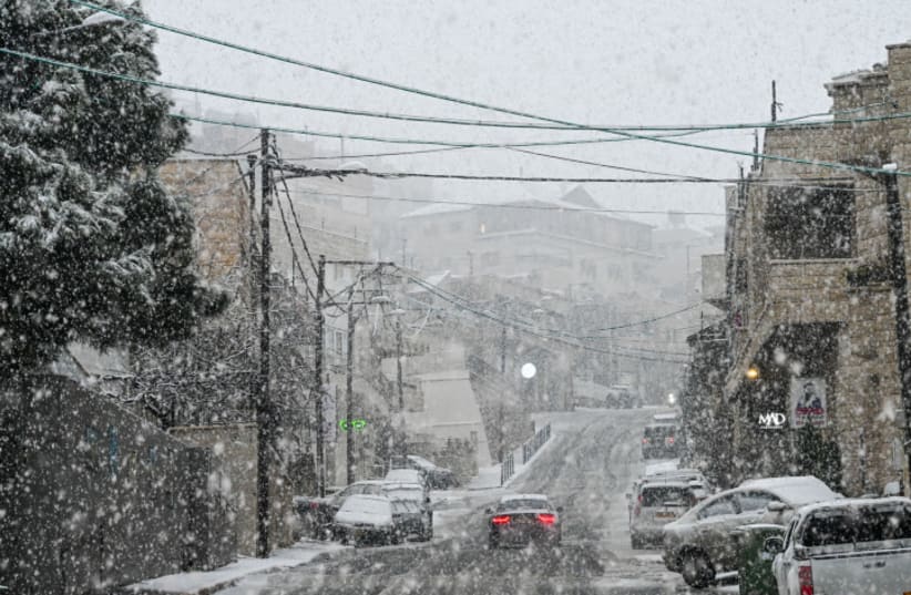  Snow falls in Majdal Shams, in the Golan Heights, Northern Israel on January 30, 2024 (photo credit: MICHAEL GILADI/FLASH90)