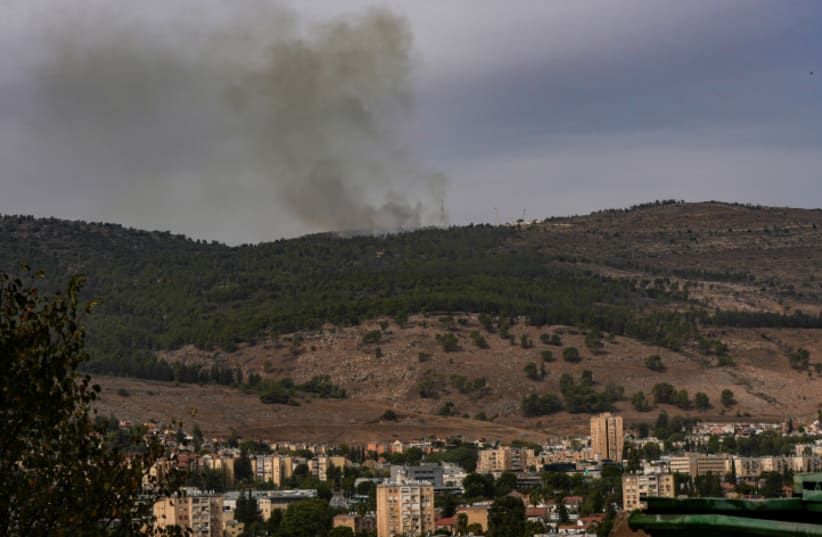  Smoke rises during an exchange of fire between the IDF and terrorists from the Hezbollah organization on the border between Israel and Lebanon, November 11, 2023 (photo credit:  Ayal Margolin/Flash90)