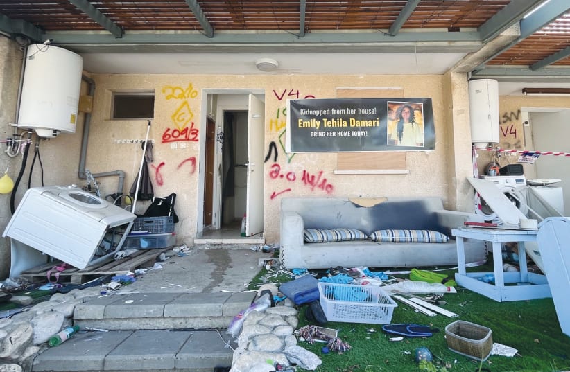  THE RANSACKED home of Emily Tehila Damari in Kfar Aza bears a banner with her name, photo, and the words: ‘Kidnapped from her house! Bring her home today!’ (photo credit: ANDREA SAMUELS)