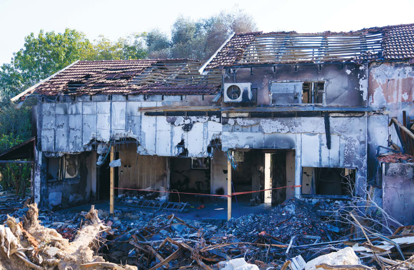  THE DESTRUCTION at Kibbutz Be’eri after the October 7 massacre: AN UNRWA elementary school teacher has been accused of being a Hamas commander and of having participated in the massacre at the kibbutz. (photo credit: MOSHE SHAI/FLASH90)