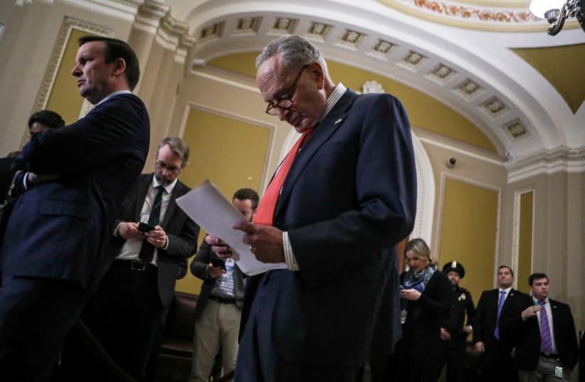  Senate Majority Leader Chuck Schumer (D-NY) looks at his notes during a press conference following weekly Senate caucus luncheons at the US Capitol in Washington, US, January 17, 2024.  (photo credit: REUTERS/Anna Rose Layden)