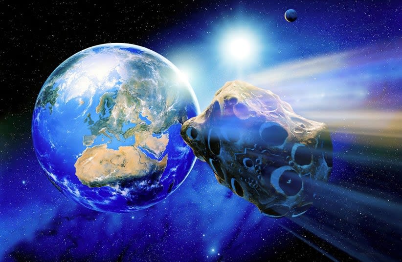  En esta ilustración artística se ve un asteroide volando cerca de la Tierra. (photo credit: PIXABAY)