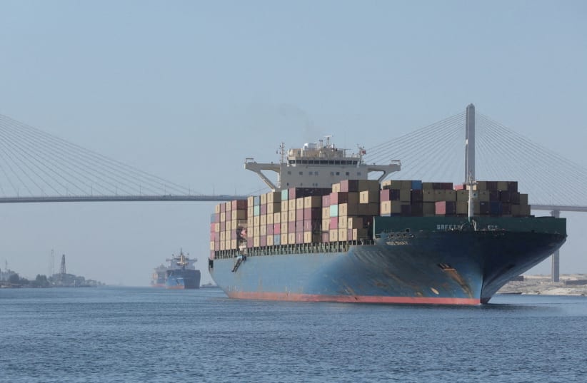  A CONTAINER SHIP sails near the Suez Canal Bridge, known as the ‘Peace Bridge.’ The Hamas-Israel war  is causing severe damage to the Egyptian economy, with the most impacted sectors being the Suez Canal and tourism, the writer says.  (photo credit: SUEZ CANAL AUTHORITY/HANDOUT VIA REUTERS)