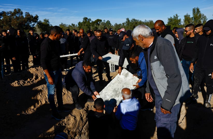  People prepare the grave during the funeral of Samer Al-Talalka, a member of Israel's Bedouin Arab minority who was mistakenly killed by IDF, December 16, 2023 (photo credit: REUTERS/CLODAGH KILCOYNE)
