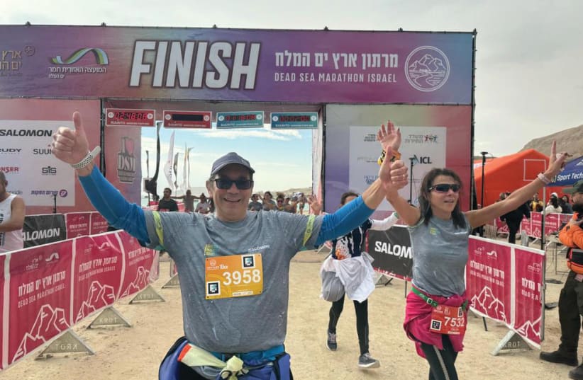 THE WRITER crosses the finish line at the Dead Sea Marathon.  (photo credit: Amiram Bogot)