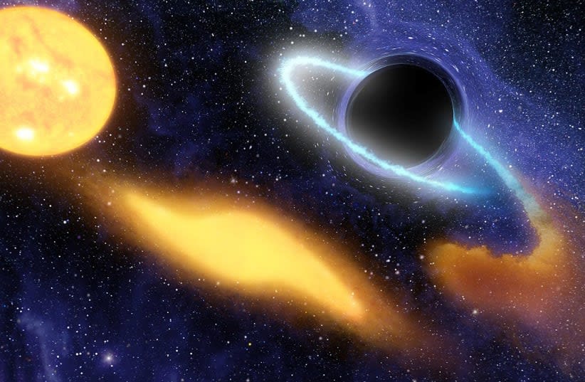  Este concepto artístico muestra un agujero negro supermasivo en el centro de una galaxia remota digiriendo los restos de una estrella. (photo credit: Wikimedia Commons)
