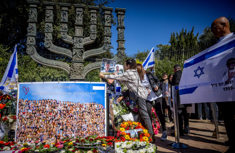  Pictures of Israelis who were murdered by Hamas terrorists at the Nova festival placed outside the Knesset in Jerusalem on February 7, 2024 (photo credit: YONATAN SINDEL/FLASH90)