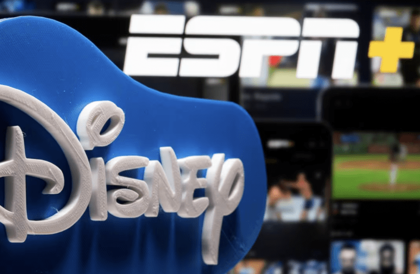  A 3D printed Disney logo is seen in front of the ESPN+ logo in this illustration taken on July 13, 2021. (photo credit: REUTERS)