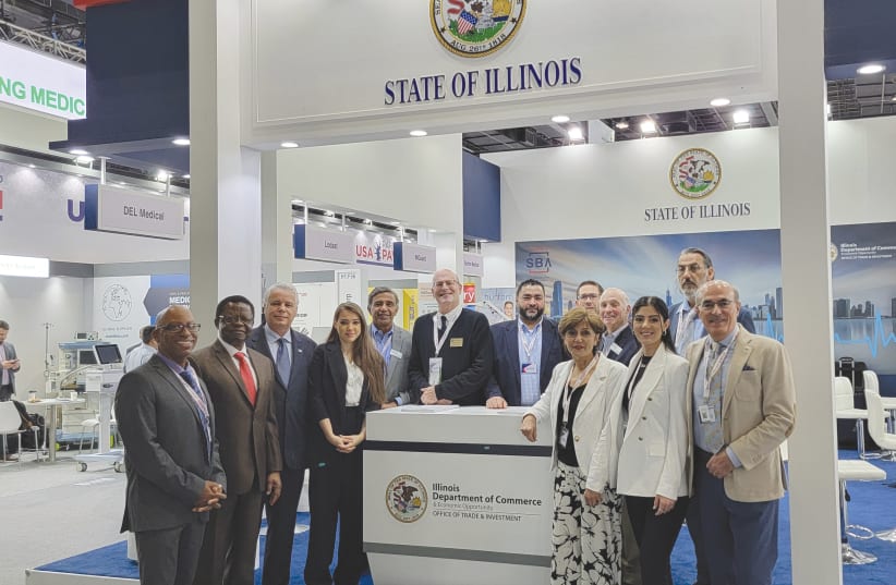  SETH VOGELMAN (sixth from left) poses with members of the State of Illinois delegation at Arab Health 2024 (photo credit: Sherwin Pomerantz)