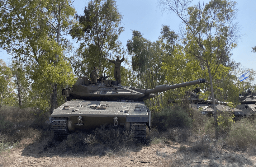  Dar Cohen and his company of Israeli Merkava IV tanks from the 401st Armored Brigade north of Gaza near Yad Mordechai on October 8, 2023. (photo credit: SETH J. FRANTZMAN)