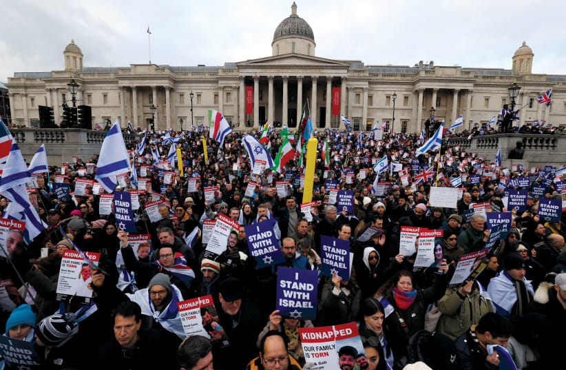   People attend the We Stand With Israel rally to express solidarity with the Jewish state, marking the 100th day since the October 7 attack by Hamas, London’s Trafalgar Square, January 14. (photo credit: REUTERS/Belinda Jiao)