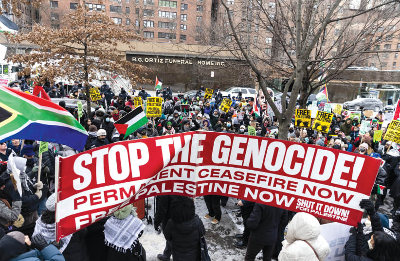  Pro-Palestinian demonstrators protest as they take part in the ‘Biden: Stop supporting genocide!’ rally in New York City on January 20.  (photo credit: JEENAH MOON/REUTERS)