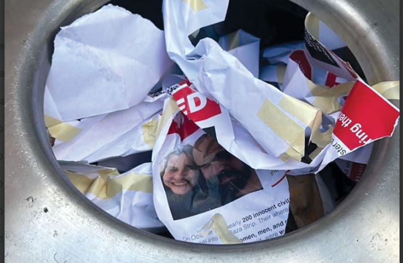  Crumpled-up Israeli hostage posters thrown out in trash cans on NYU campus. (photo credit: Collin Byun)