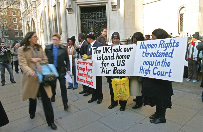  CHAGOSSIAN ISLANDERS protest at London’s Court of Appeal, in 2007. (photo credit: Carl de Souza/AFP via Getty Images)