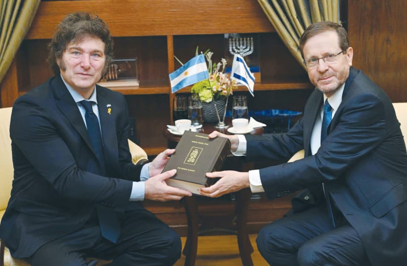  PRESIDENT ISAAC HERZOG presents a bilingual edition of the Koren Bible to Argentine President Javier Milei. (photo credit: HAIM ZACH/GPO)