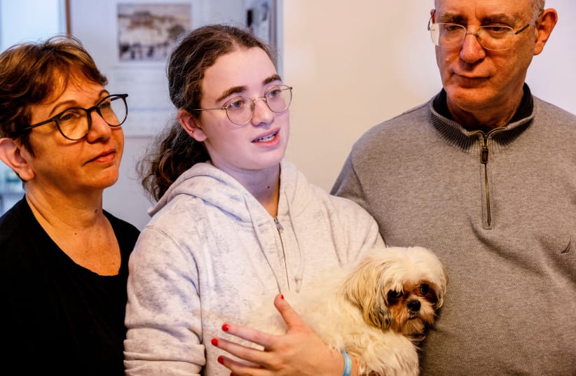  Mia Leimberg, 17, released from captivity after being taken hostage by Hamas in the Gaza Strip with her mother Gabriela and her dog Bella, December 5, 2023 (photo credit: RONEN ZVULUN/REUTERS)