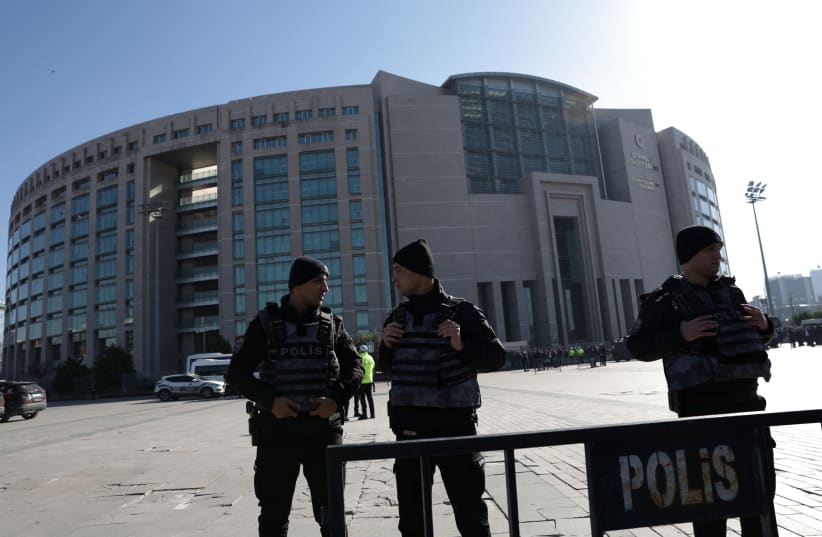  Police officers stand guard outside the Caglayan courthouse after a shooting in Istanbul, Turkey February 6, 2024. (photo credit: REUTERS/MURAD SEZER)