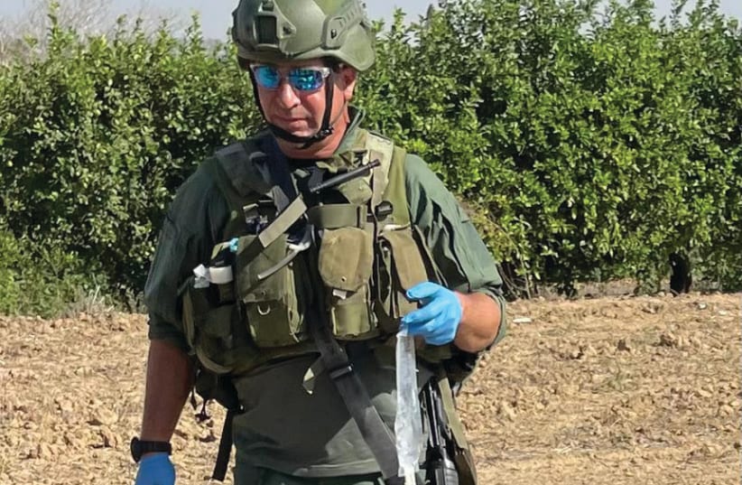 THE WRITER takes part in a medical training exercise on the Gaza border. (photo credit: Tuvia Book)