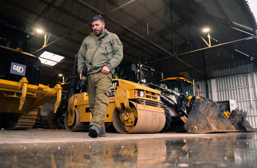  ASI HAGIAN of the IDF engineers discusses how the army uses earth-moving equipment to build new routes in the North.  (photo credit: IDF SPOKESPERSON'S UNIT)
