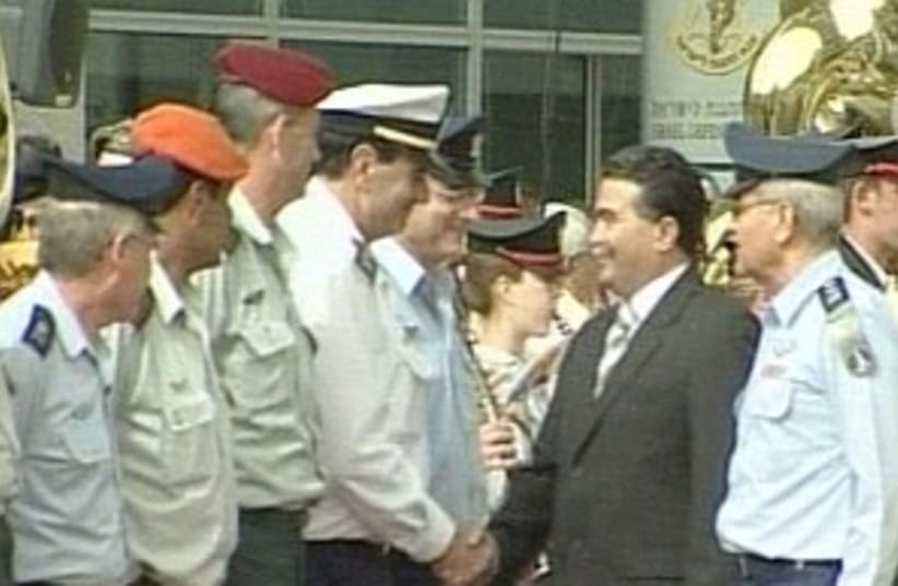 peretz shakes hands with (photo credit: Channel 10 [file])